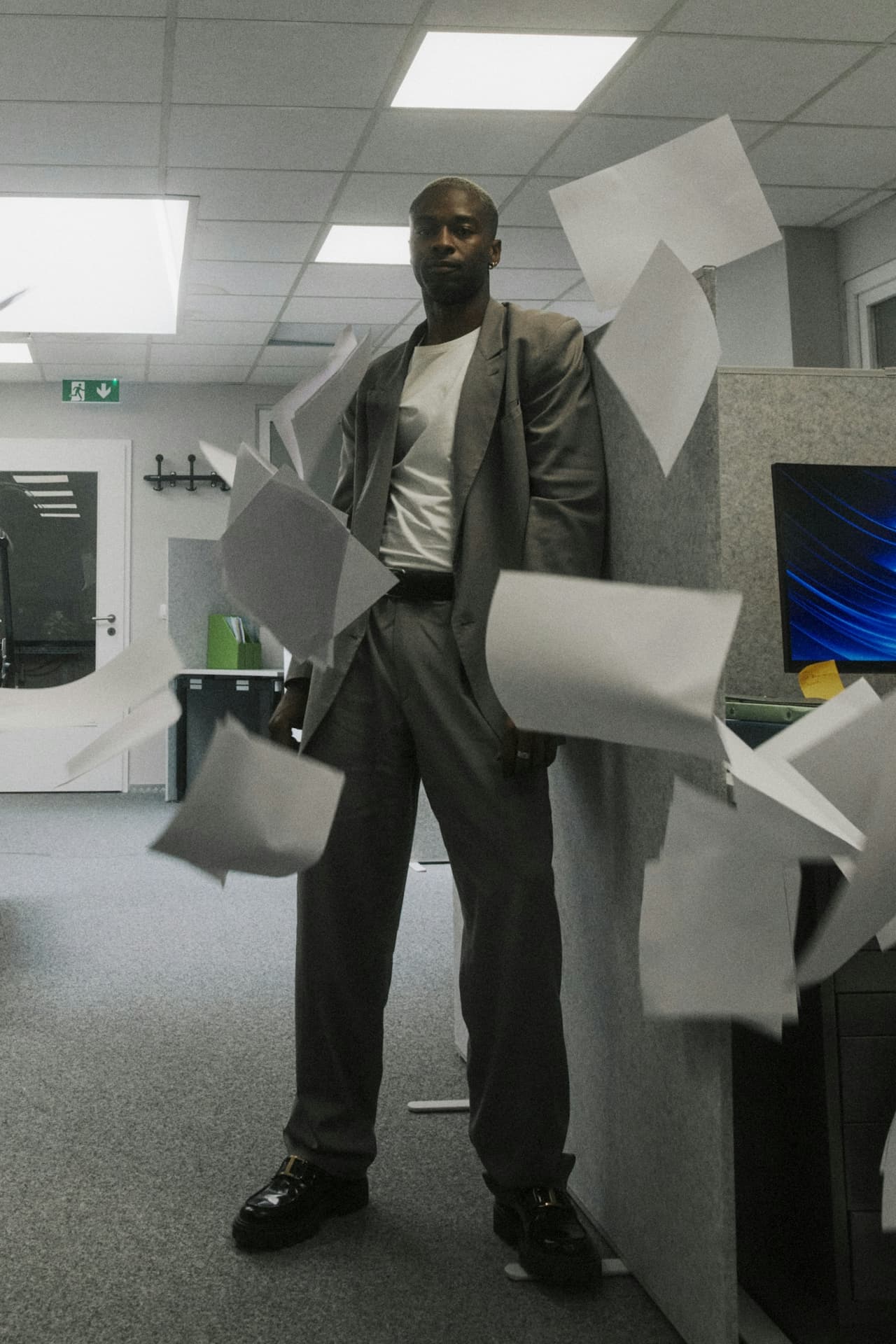 Confident professional with papers — systems in place